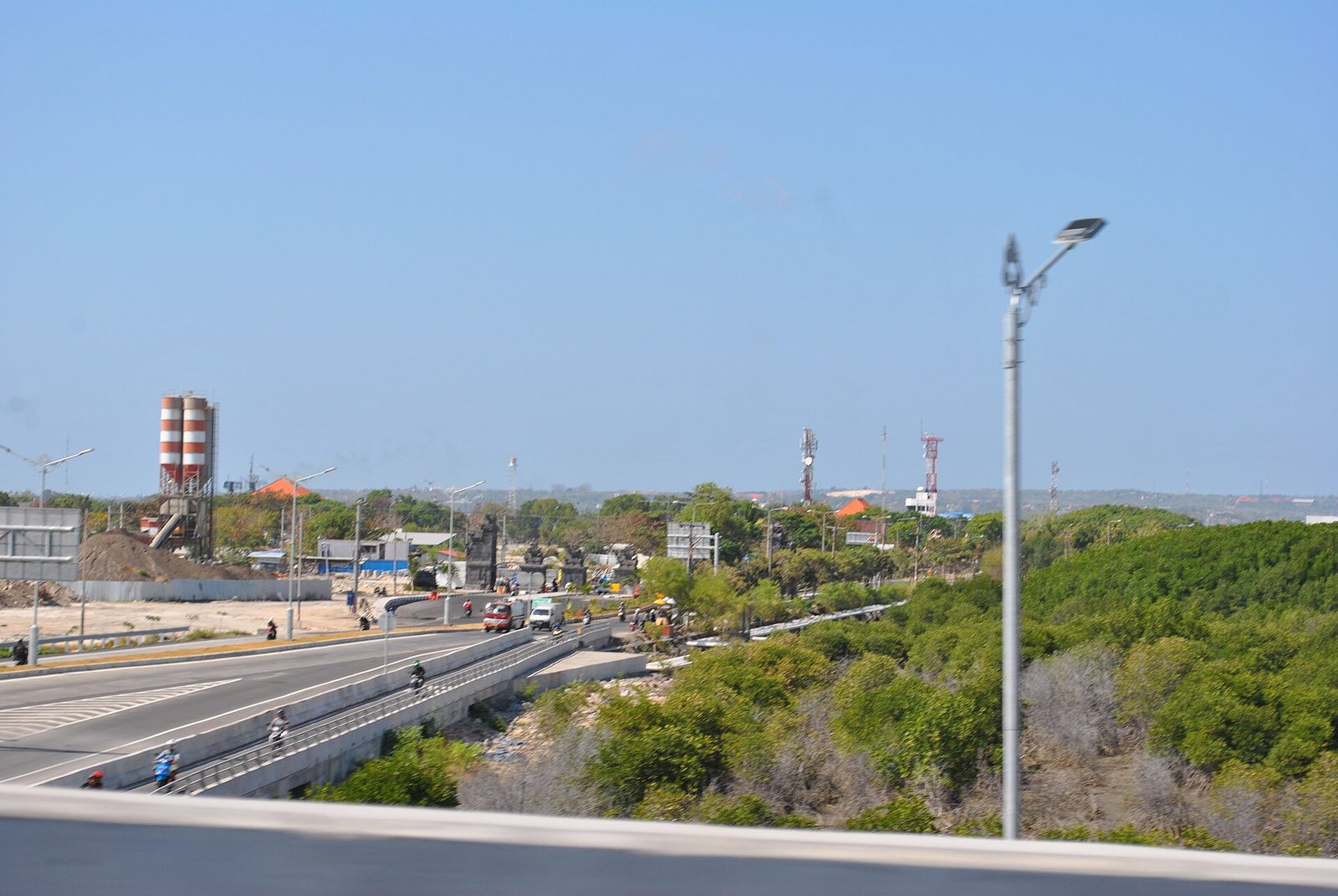 Bali Mandara toll road passing low mangroves near the airport