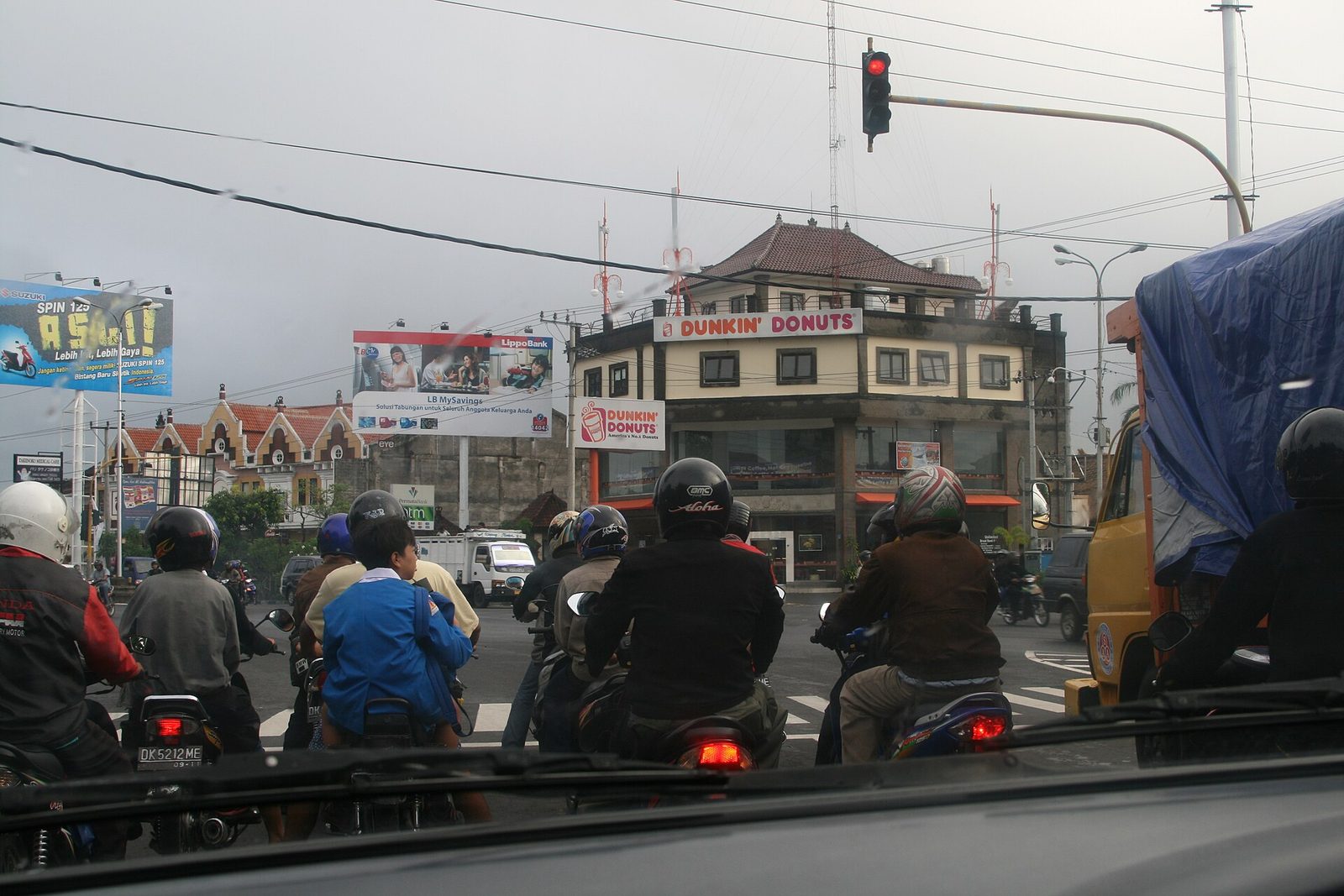 Cars and scooters waiting at traffic lights on the Ngurah Rai Bypass near Sanur