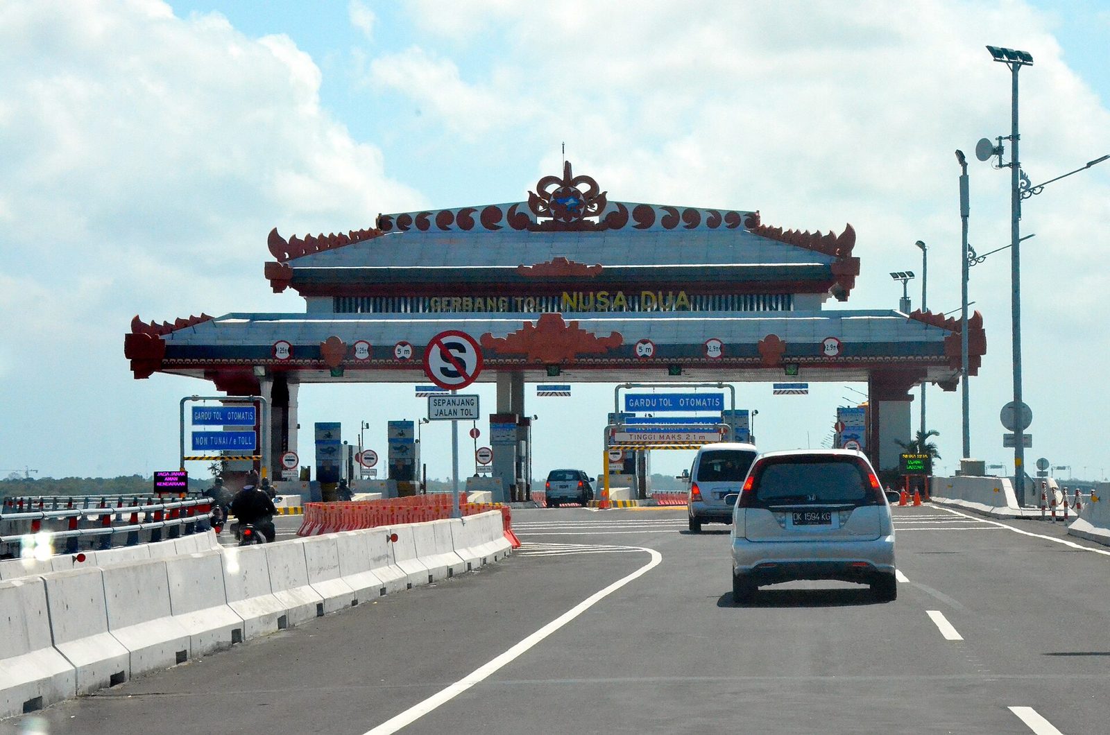 Car approaching the Nusa Dua toll plaza on the Bali Mandara toll road