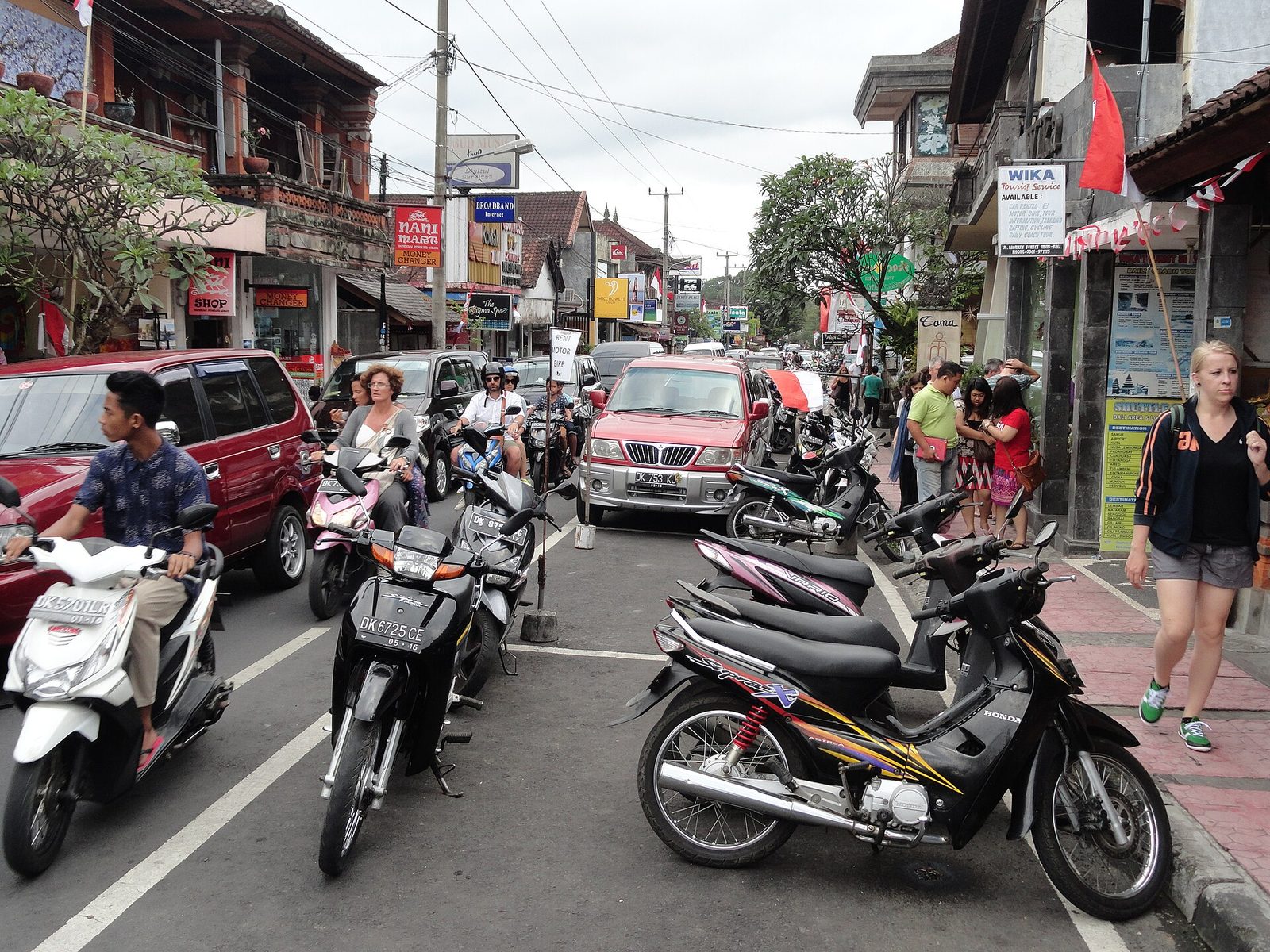 Scooters, cars and pedestrians crowding Jalan Monkey Forest in central Ubud