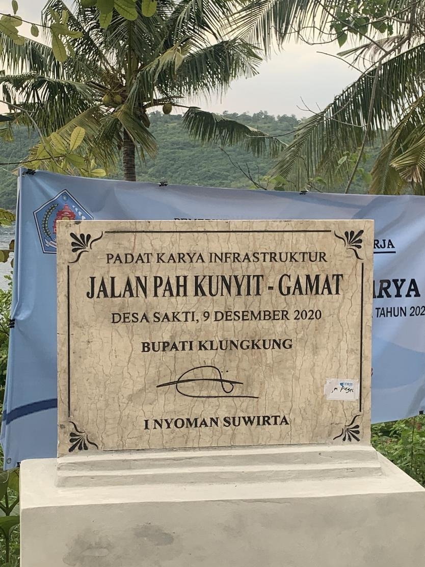 Plaque marking the December 2020 road project towards Gamat Bay in Sakti
