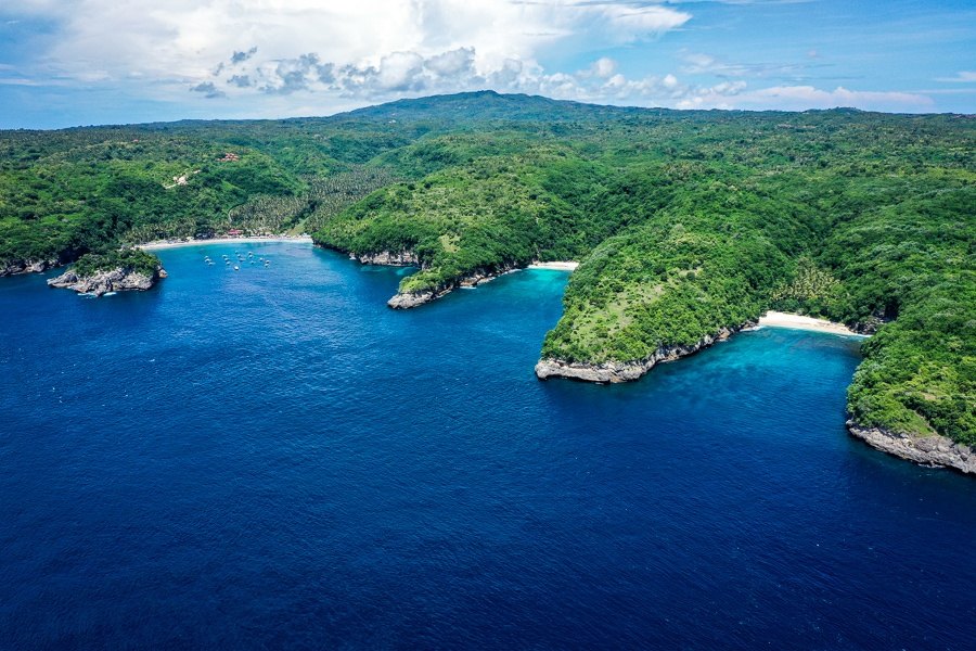 Aerial view of Crystal Bay, Pandan and Puyung separated by headlands
