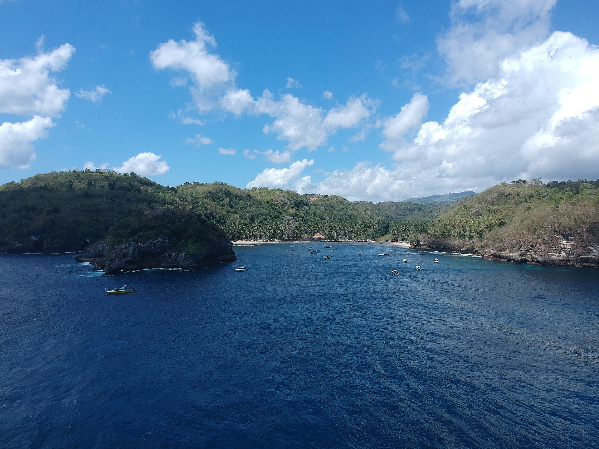 Crystal Bay and its curved beach seen from the surrounding hillside