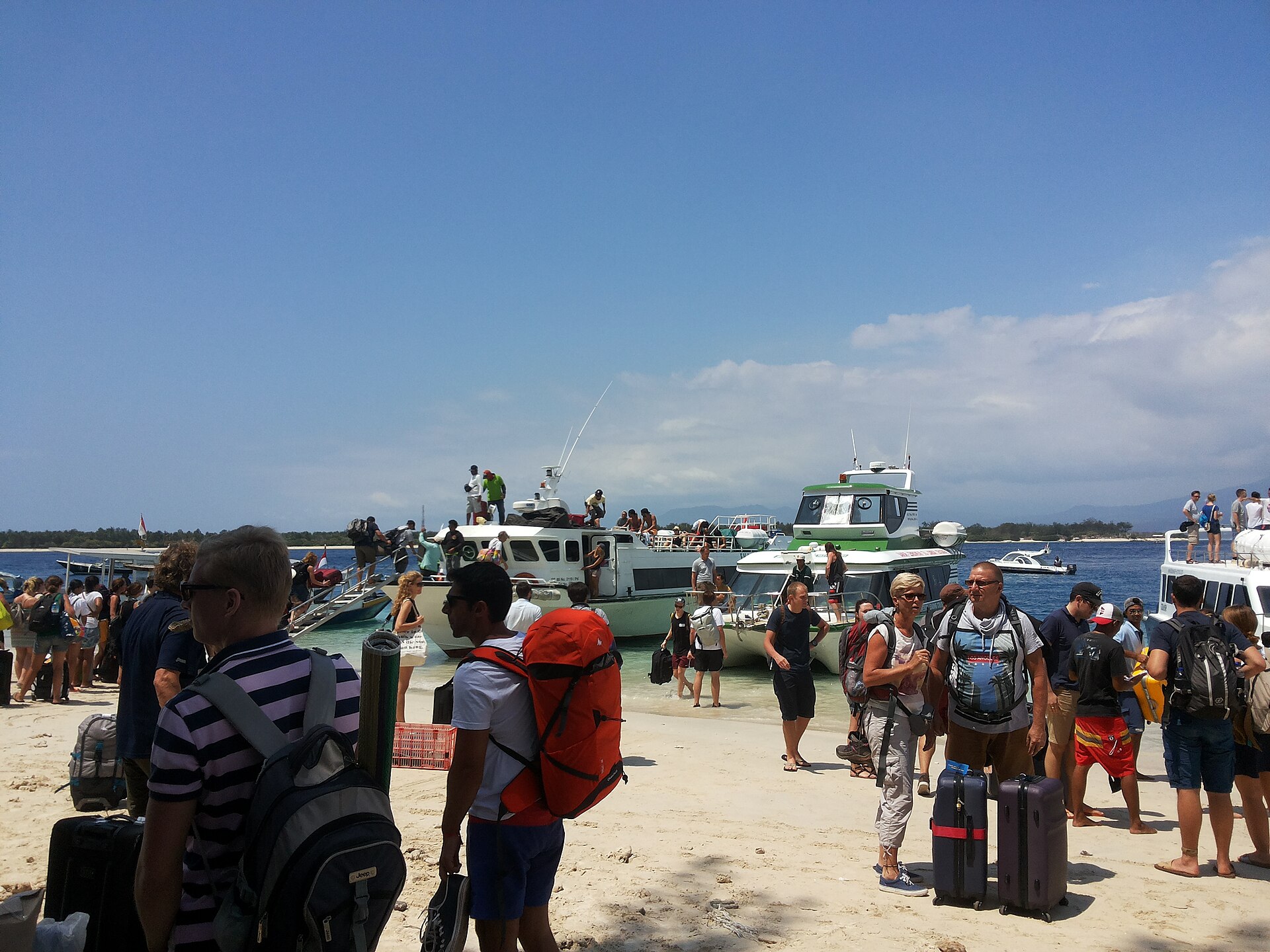Passengers preparing for an inter-island boat journey in Indonesia