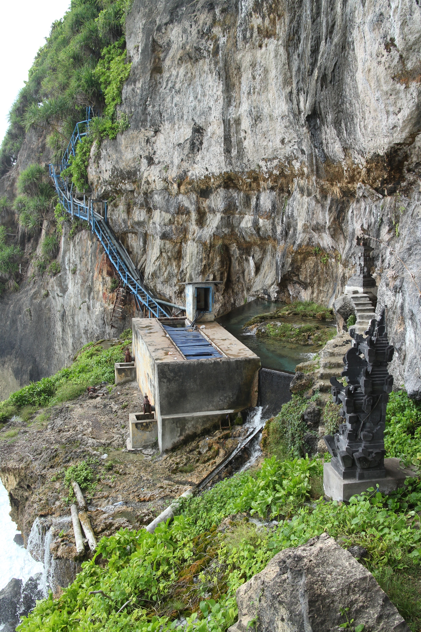Blue staircase descending the cliff at Peguyangan in south Nusa Penida