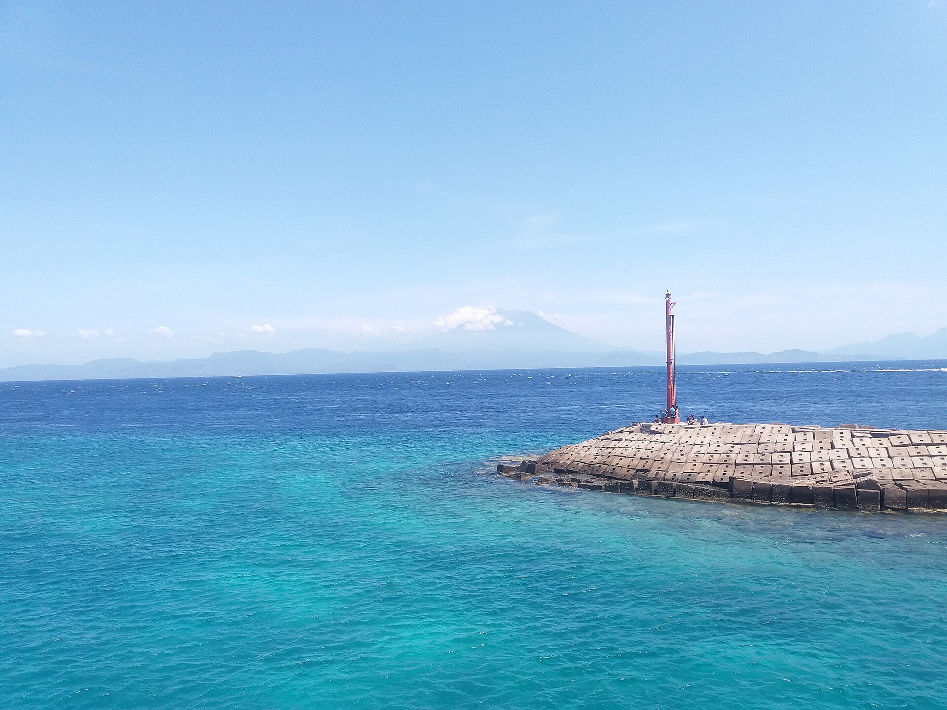 Blue water and a rocky headland on the Nusa Penida coast