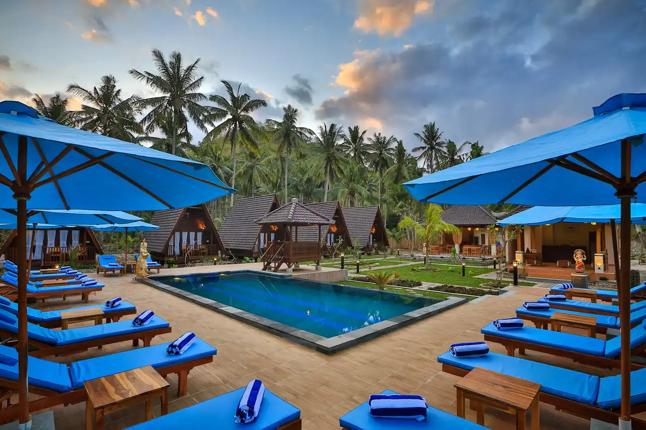 Pool and tropical bungalows at Mahaloka Valley Resort