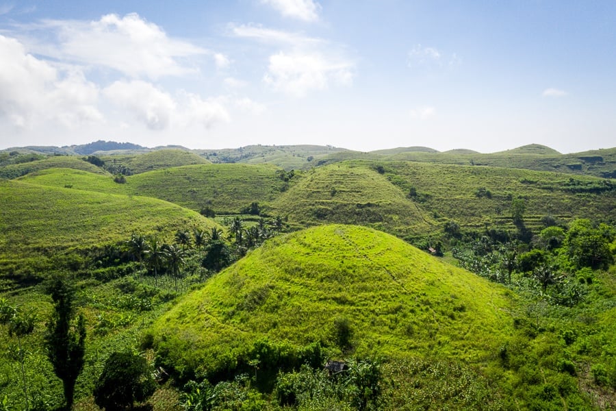 Rounded green slopes at Teletubbies Hill in southeast Nusa Penida